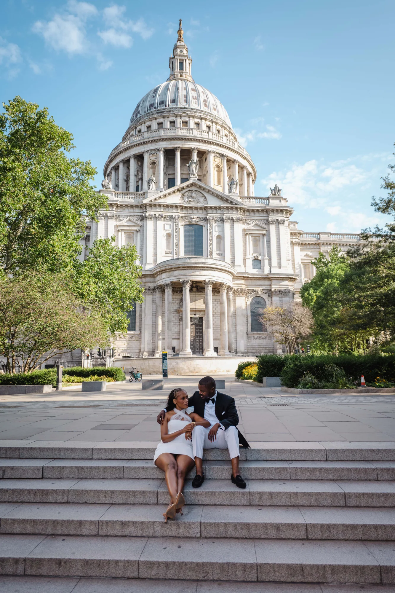 Kennedy and Didimalang seated outside St Paul's Cathedral