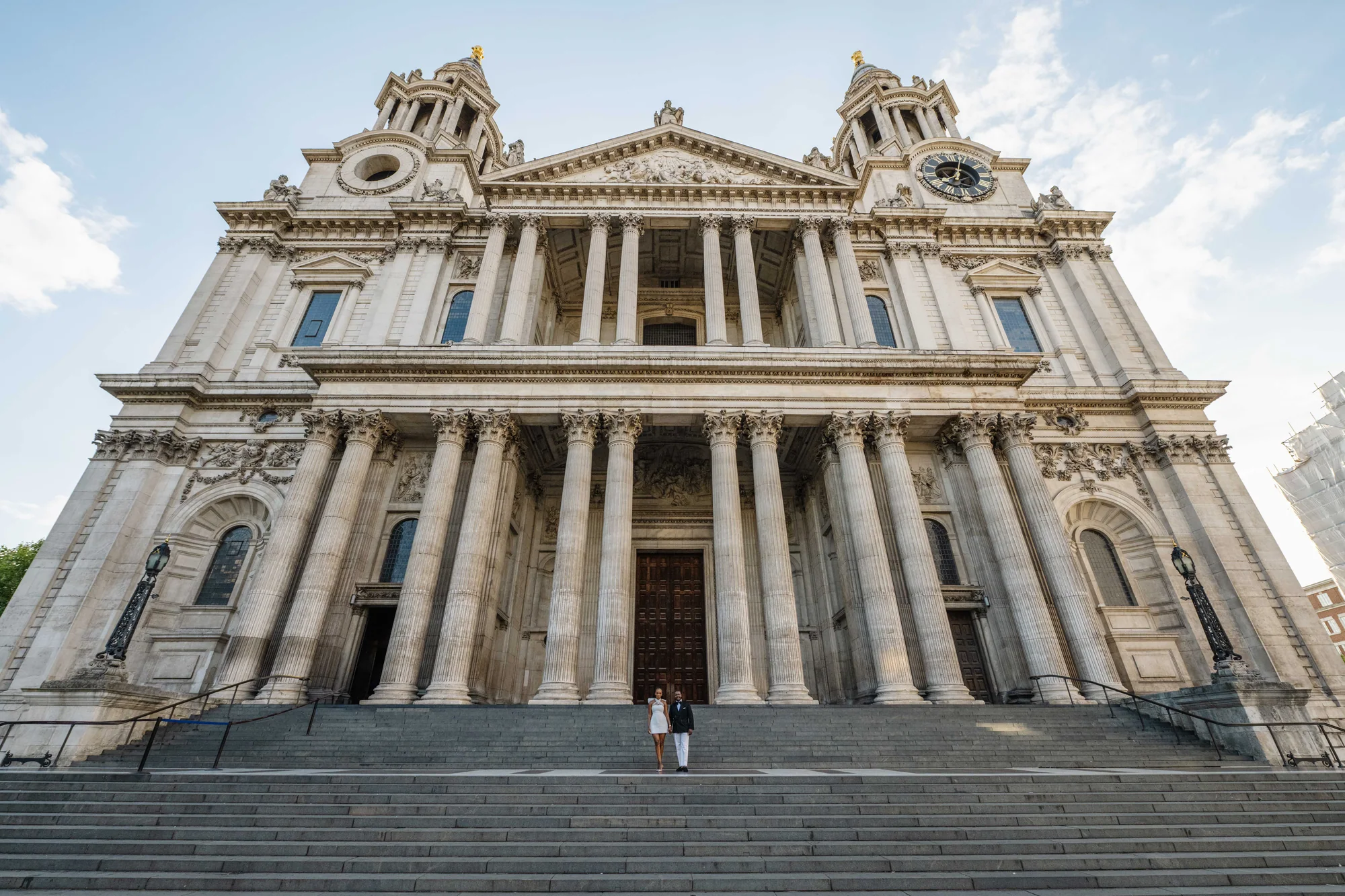 Kennedy and Didimalang beneath the grand facade of St Paul's