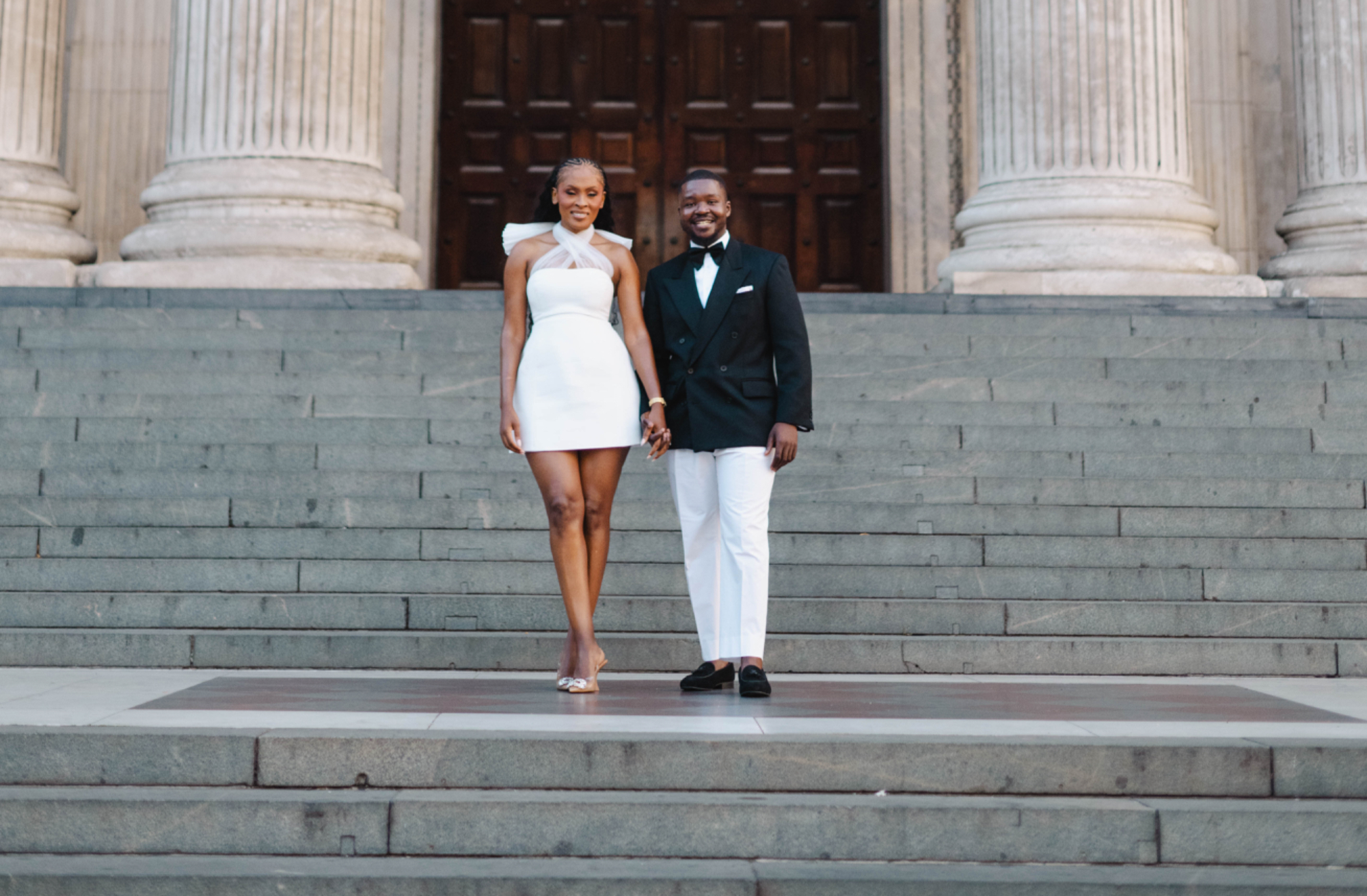 Kennedy and Didimalang smiling on the cathedral steps